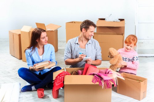 Packed moving boxes and furniture ready for transport