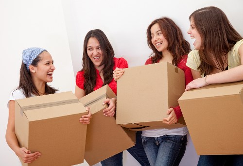 Commercial movers organizing desks and equipment during an office move