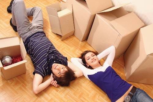 Professional movers handling furniture during a same day move